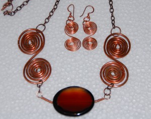 Copper swirls with red agate stone and copper chain